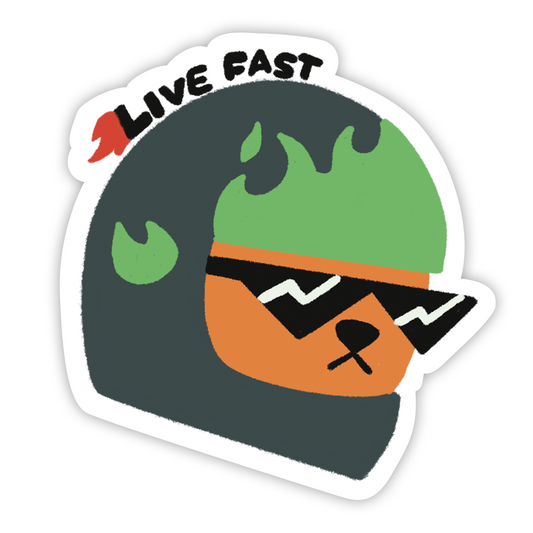 Sticker mockup. A dog wearing black sunglasses and a bike helmet with green flames. Text with flames trailing behind reads "Live fast".